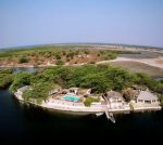 les-barracudas - photo taken from the sky you can see that the ecolodge is on the shores of the lake, the bungalows and the pool